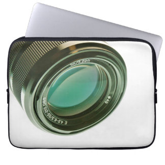 Lens of a photocamera, a sharp look. laptop sleeve