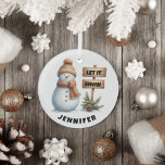 Let it Snow Cosy Winter Snowman Custom Name Glass Tree Decoration<br><div class="desc">Embrace the magic of winter with our delightful Snowman Christmas Ornament! Featuring an adorable snowman dressed in a cosy hat and scarf, this enchanting piece is sure to bring a smile to your face. Next to him stands a charming sign that says “Let it Snow, ” Surrounded by lush evergreen...</div>