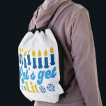 Let's Get Lit! Backpack<br><div class="desc">This cheeky Hanukkah pattern is an eye-catcher! It's a fun and funky way to dress up decor,  gifts,  apparel,  and household items for the occasion. Check out my store for more pattern items and gift ideas,  or combine items to create an interesting gift package!</div>