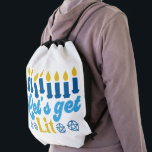 Let's Get Lit! Backpack<br><div class="desc">This cheeky Hanukkah pattern is an eye-catcher! It's a fun and funky way to dress up decor, gifts, apparel, and household items for the occasion. Check out my store for more pattern items and gift ideas, or combine items to create an interesting gift package!</div>