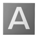 Letter Tiles- White on grey Tile<br><div class="desc">Ceramic letter tiles.  Upper or lower case letter tiles.  You customise with the letter or letters you need for your ceramic tile or mosaic sign.  Letter tile for weather proof signs,  house numbers.  White on grey background.</div>
