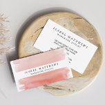 Light Coral Watercolor & White Stripe Business Card<br><div class="desc">Simple,  elegant and feminine,  these cards are a beautiful way to brand your business. Front features a watercolor wash background in muted coral hues,  with your name and title/company displayed in a crisp white stripe. Customise the back with your full contact information.</div>