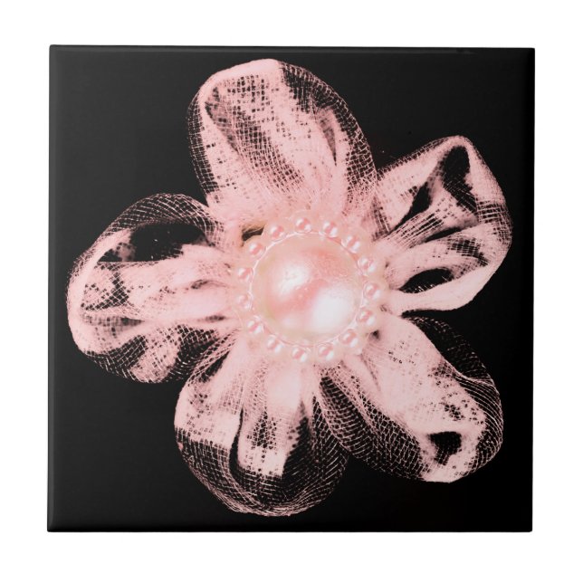 Light pink tulle flower on black tile (Front)