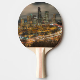Light streaks from cars at night ping pong paddle