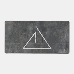 Light Symbol on Dark Concrete Desk Mat