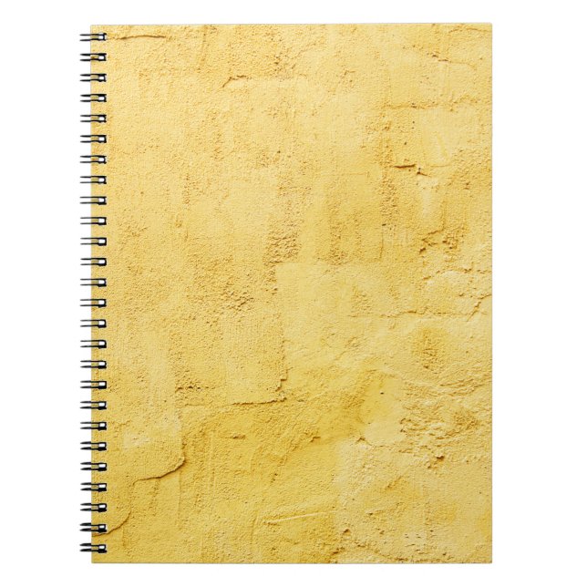 light yellow abstract textured plaster on the wall notebook (Front)