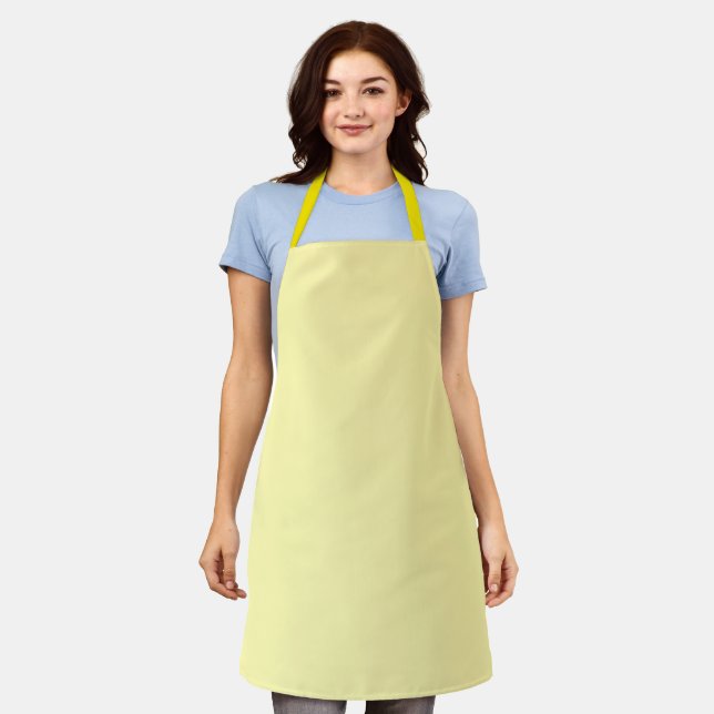 light yellow apron features a simple, clean design (Worn)