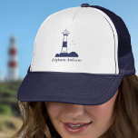 Lighthouse Navy Blue Trucker Hat<br><div class="desc">A simple cap with an illustration of a lighthouse and a customisable name in navy blue tones!
It could be an excellent gift for a sailor,  a boat owner or a lover of oceans and maritime coasts!</div>