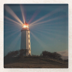 Lighthouse on a Hill Shining at Night Glass Coaster