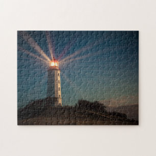 Lighthouse on a Hill Shining at Night Jigsaw Puzzle