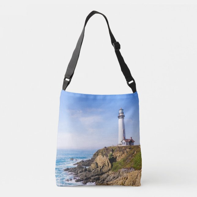 Lighthouse on hill blue sky white house ocean crossbody bag (Back)