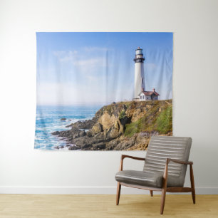 Lighthouse on hill blue sky white house ocean tapestry