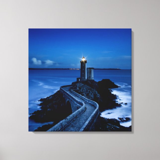 Lighthouse on wall in ocean at night canvas print (Front)