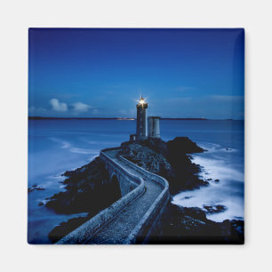 Lighthouse on wall in ocean at night magnet