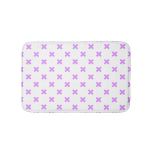 Lilac cross stitches on white bath mat