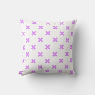 Lilac cross stitches on white cushion