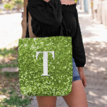Lime Green Faux Glitter Bokeh Sparkly Monogram Tote Bag<br><div class="desc">A modern bold single letter monogram in white with a black drop shadow. The font size, colour and style are customisable. The background is a lime green glitter with sparkly spots or bokeh. Move or delete the tiny faux sparkle graphic images. A custom gift for a bridesmaid or other member...</div>