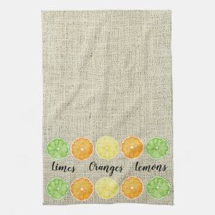 Limes Oranges and Lemons on Linen Background Tea Towel