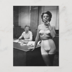 Lingerie model smoking in an office postcard