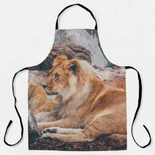 LION AND LIONESS LYING ON BROWN SURFACE APRON