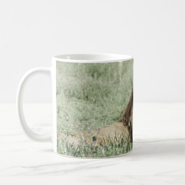 LION LYING ON GREEN GRASS DURING DAYTIME COFFEE MUG (Left)