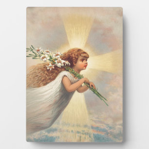 Little baby angel holding lilies plaque