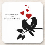 little birds with hearts coaster<br><div class="desc">Bring a tender touch to your table. This charming coaster design features a delicate black bird paired with vivid red hearts — a subtle yet powerful celebration of love, family bonds, and unforgettable moments. Perfect for cosy evenings, warm conversations, or as a heartfelt gift. Let the art speak softly, and...</div>