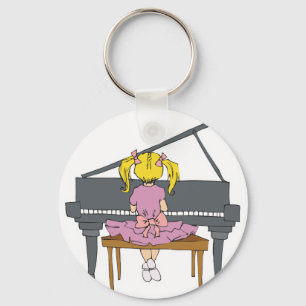 little girl playing piano key ring