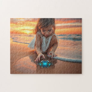 Little girl playing with a crab jigsaw puzzle