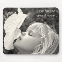 Little girl smelling hibiscus