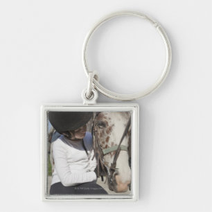 Little girl with her horse key ring