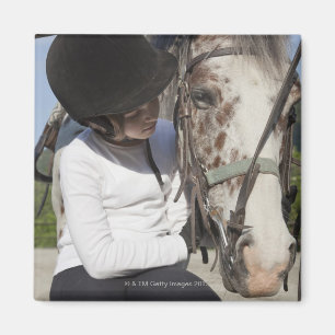 Little girl with her horse magnet
