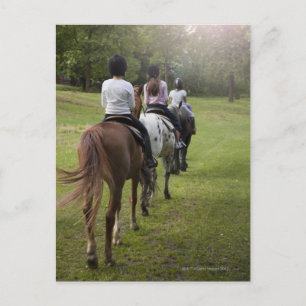 Little girls riding horses postcard