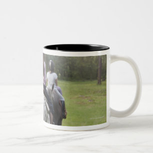 Little girls riding horses Two-Tone coffee mug