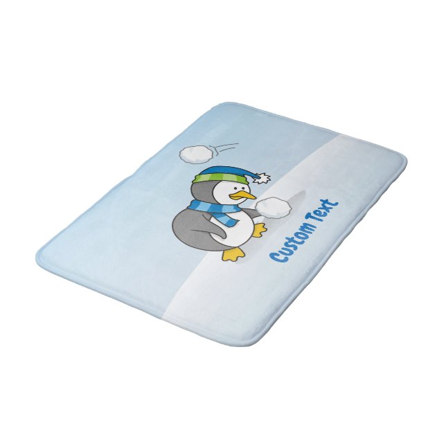 Little penguin getting a snow ball bathroom mat (Angled)