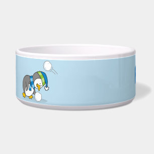 Little penguin getting a snow ball bowl