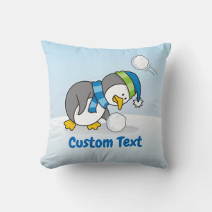 Little penguin getting a snow ball cushion