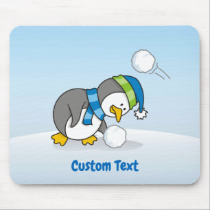 Little penguin getting a snow ball mouse pad