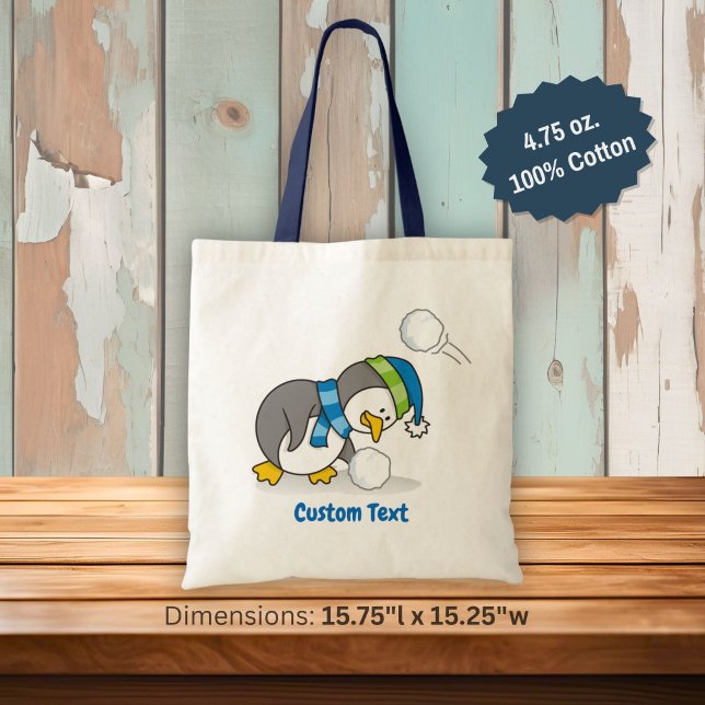 Little penguin getting a snow ball tote bag (Creator Uploaded)
