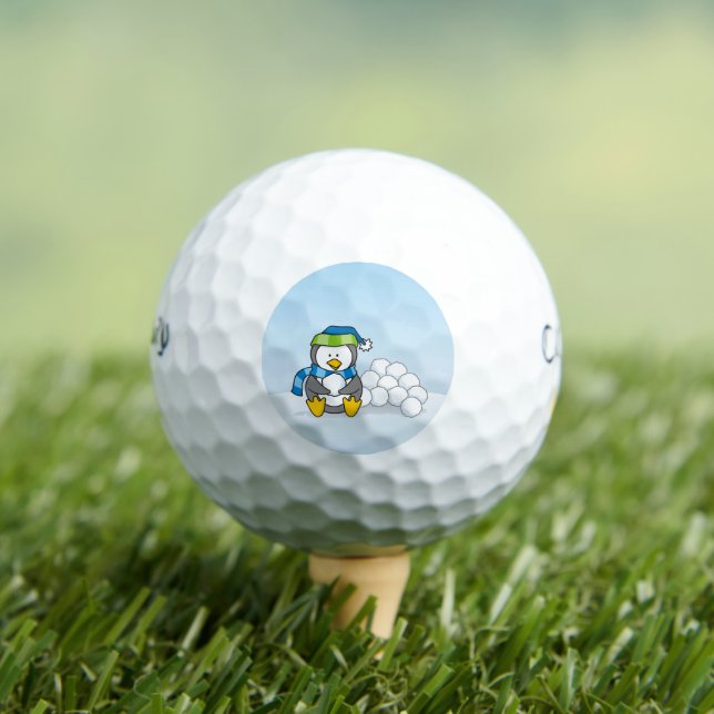 Little penguin sitting with snowballs golf balls (Insitu Tee)