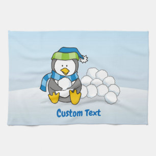 Little penguin sitting with snowballs kitchen towe tea towel