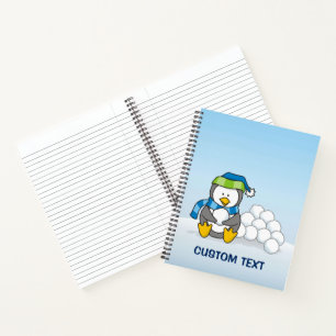 Little penguin sitting with snowballs notebook