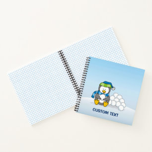 Little penguin sitting with snowballs notebook