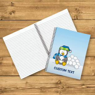 Little penguin sitting with snowballs notebook