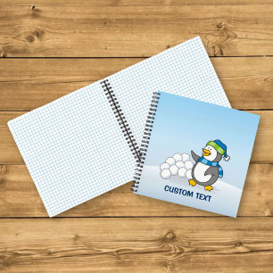Little penguin with snow balls waving notebook