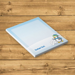Little penguin with snow balls waving notepad