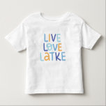Live Love Latke Hanukkah Design Toddler T-Shirt<br><div class="desc">Celebrate the joy of Hanukkah with this colourful "Live Love Latke" design. Featuring bright colours and playful typography,  this graphic is perfect for a variety of products,  from home decor to gifts. Add a touch of holiday spirit and deliciousness to your space with this fun and festive design.</div>
