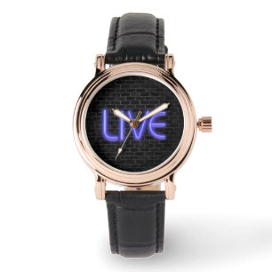 LIVE text in neon lighting on brick Watch