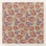 Lively Red and Purple Leaf Motifs on Neutral Beige Glass Coaster<br><div class="desc">Pattern of red and purple leaf designs on a beige background. The bold,  intricate leaves create a lively and dynamic contrast,  evoking a tropical feel.</div>