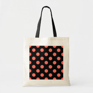 Living coral polka dots on black tote bag